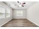 Bright bedroom with ceiling fan and two windows providing plenty of natural light at 2376 S Us 321 Hwy, Newton, NC 28658