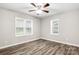 Bedroom with ceiling fan and natural light from dual windows at 2376 S Us 321 Hwy, Newton, NC 28658