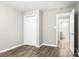 This bedroom has light gray walls, a closet, and wood look flooring at 2376 S Us 321 Hwy, Newton, NC 28658