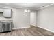 Dining area adjacent to kitchen with wood-look flooring and modern appliances at 2376 S Us 321 Hwy, Newton, NC 28658