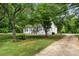 Home's exterior with trees, grassy yard, and a driveway on the side at 2376 S Us 321 Hwy, Newton, NC 28658