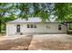 Back exterior view of a home with an adjacent carport and small back porch at 2376 S Us 321 Hwy, Newton, NC 28658
