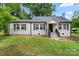 Charming one story home with brick exterior, black shutters and a well-manicured lawn at 2376 S Us 321 Hwy, Newton, NC 28658