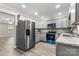 Modern kitchen featuring stainless steel appliances, granite counters, gray cabinets, and wood-look flooring at 2376 S Us 321 Hwy, Newton, NC 28658