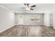 Bright living room with crown molding, ceiling fan, lots of natural light and gray wood-look floors at 2376 S Us 321 Hwy, Newton, NC 28658