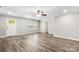 Bright living room with crown molding, ceiling fan, lots of natural light and gray wood-look floors at 2376 S Us 321 Hwy, Newton, NC 28658
