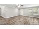 Bright living room with crown molding, ceiling fan, lots of natural light and gray wood-look floors at 2376 S Us 321 Hwy, Newton, NC 28658
