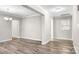 Open living room with wood-look floors, neutral walls, and modern trim at 2376 S Us 321 Hwy, Newton, NC 28658