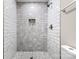 Stylish tiled walk-in shower features pebble floor, subway tile walls, and a built-in niche at 2376 S Us 321 Hwy, Newton, NC 28658