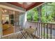 Charming balcony with outdoor seating and a glimpse of the living area at 2502 Cranbrook Ln # 8, Charlotte, NC 28207