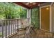 Inviting balcony with outdoor seating and green, wooded views at 2502 Cranbrook Ln # 8, Charlotte, NC 28207