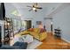 Bright living room with cozy seating, fireplace, and access to an outdoor deck at 2502 Cranbrook Ln # 8, Charlotte, NC 28207