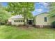 Quaint home featuring a cozy backyard with mature trees and a partially fenced yard at 2556 Salem Church Rd, Lincolnton, NC 28092