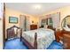 Bedroom features neutral paint, carpet, and a comfortable bed at 2556 Salem Church Rd, Lincolnton, NC 28092