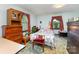 Cozy bedroom with carpet features a floral comforter, natural light, and ample storage at 2556 Salem Church Rd, Lincolnton, NC 28092