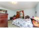 Light-filled bedroom boasts a floral comforter, neutral paint, and carpeted floors at 2556 Salem Church Rd, Lincolnton, NC 28092
