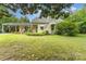 Charming home with a covered carport, complemented by mature trees and vibrant landscaping at 2556 Salem Church Rd, Lincolnton, NC 28092