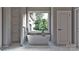 Relaxing bathroom with a freestanding tub, modern fixtures, and natural light at 2601 Greenmont Cir, Belmont, NC 28012