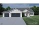 Charming single-Gathering home with three-car garage, stone accents, and lush lawn at 2601 Greenmont Cir, Belmont, NC 28012