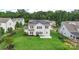 Beautiful backyard of home with solar panels, green lawn, and privacy fence at 3211 Gilroy Dr, Fort Mill, SC 29707