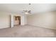 Bedroom with an open doorway, ceiling fan and neutral carpet at 3211 Gilroy Dr, Fort Mill, SC 29707