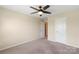 Bedroom with an open doorway and a ceiling fan and a neutral carpet at 3211 Gilroy Dr, Fort Mill, SC 29707