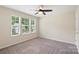 Bedroom with a large window providing natural light and neutral carpet at 3211 Gilroy Dr, Fort Mill, SC 29707