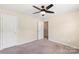 Bedroom with an open doorway and a ceiling fan and a neutral carpet at 3211 Gilroy Dr, Fort Mill, SC 29707