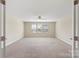 Bedroom with an open doorway, ceiling fan and neutral carpet at 3211 Gilroy Dr, Fort Mill, SC 29707