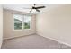 Bedroom with a window, ceiling fan and neutral carpet at 3211 Gilroy Dr, Fort Mill, SC 29707