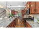 Gourmet kitchen featuring granite countertops, stainless steel appliances and a central kitchen island at 3211 Gilroy Dr, Fort Mill, SC 29707