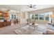 The living room features a large window with views to outside with a view of the kitchen and dining area at 3211 Gilroy Dr, Fort Mill, SC 29707