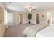 A large primary bedroom with ample closet space and a view into the bathroom at 3211 Gilroy Dr, Fort Mill, SC 29707