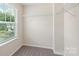 Walk-in closet with carpet flooring, shelving and a window for natural light at 3211 Gilroy Dr, Fort Mill, SC 29707