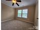 Bright bedroom with neutral carpet and a double window providing ample natural light at 4009 Egrets Nest Ct, Mount Holly, NC 28120