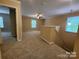 Large bonus room with neutral paint, carpet, several windows, and easy access to other rooms at 4009 Egrets Nest Ct, Mount Holly, NC 28120