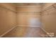 Walk-in closet with wire shelving and neutral carpet for storage and organization at 4009 Egrets Nest Ct, Mount Holly, NC 28120