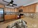 A kitchen with granite countertops, tile backsplash, and stainless steel appliances at 4009 Egrets Nest Ct, Mount Holly, NC 28120
