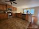Kitchen with tile flooring, stainless steel appliances, ample cabinets and an adjacent dining area at 4009 Egrets Nest Ct, Mount Holly, NC 28120