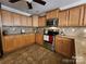 A kitchen with granite countertops, tile backsplash, and stainless steel appliances at 4009 Egrets Nest Ct, Mount Holly, NC 28120