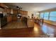 Kitchen with tile flooring, stainless steel appliances, ample cabinets and an adjacent dining area at 4009 Egrets Nest Ct, Mount Holly, NC 28120