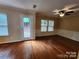 Living room with wood flooring and lots of light with direct access to the backyard at 4009 Egrets Nest Ct, Mount Holly, NC 28120