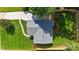 A bird's-eye view of the property showing the roofline, lawn, and perimeter fencing at 4042 Uppergate Ln, Charlotte, NC 28215