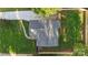 Birds eye view of home, including the roof, driveway, and fenced yard with healthy green grass at 4042 Uppergate Ln, Charlotte, NC 28215