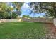 Spacious, grassy backyard enclosed by a new wooden fence, perfect for outdoor activities at 4042 Uppergate Ln, Charlotte, NC 28215