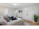 Bright bedroom with a large closet, neutral decor, and light wood floors at 4042 Uppergate Ln, Charlotte, NC 28215