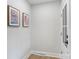 Entry hallway featuring neutral colors, modern art, and a bright, welcoming atmosphere at 4042 Uppergate Ln, Charlotte, NC 28215