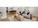 Open-concept living room with modern furnishings, wood coffee table, and view into the kitchen at 4042 Uppergate Ln, Charlotte, NC 28215