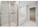 Spacious main bathroom with glass shower, soaking tub and tile flooring at 4114 Vista Pine Dr, Charlotte, NC 28215