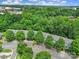 Aerial view of residential community with mature trees, well-maintained landscaping, and ample parking at 413 Hurston Cir, Charlotte, NC 28208